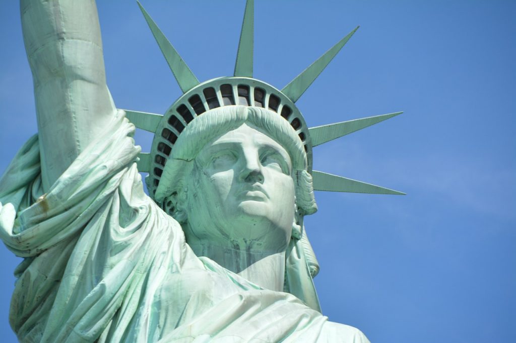 Close up of Statue of Liberty features on a sunny day in NYC