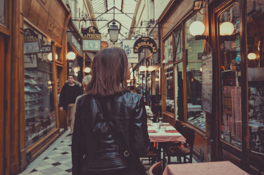Woman walking through passages in Paris
