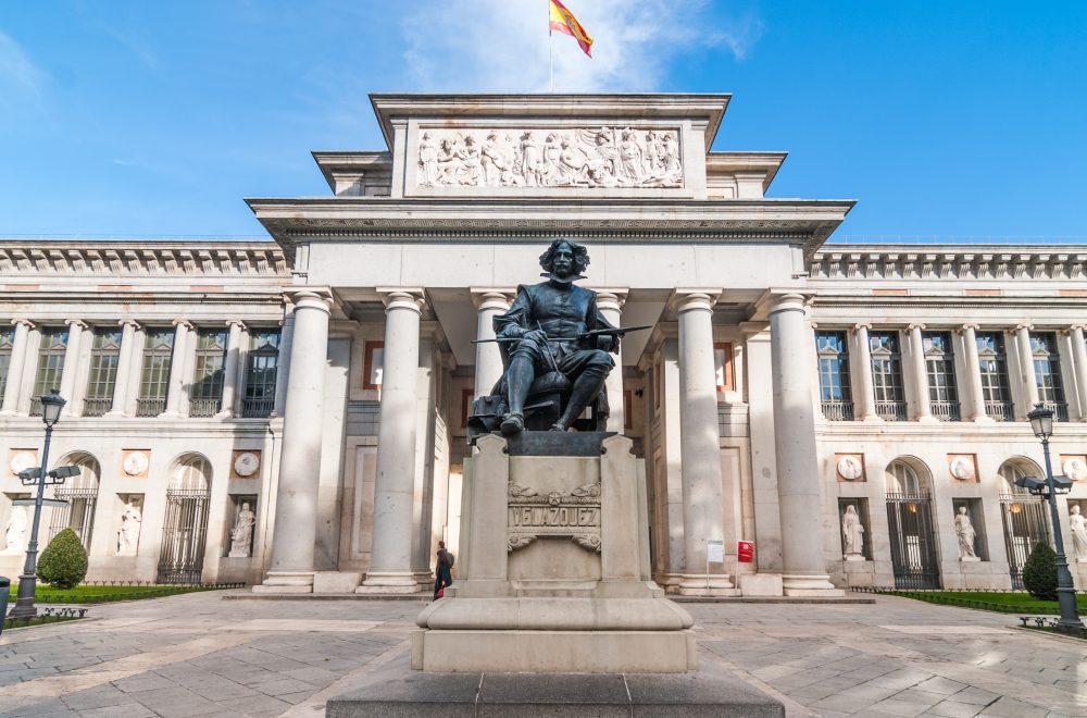Clear sky and warm day for a visit to The Prado Museum. Front entrance and terrace to the Museo del Prado, Spanish national art museum, located in central Madrid.