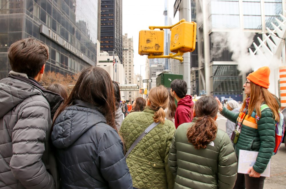 Tour Guide with Group looking at building during 911 NYC Tour