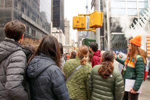 Tour Guide with Group looking at building during 911 NYC Tour