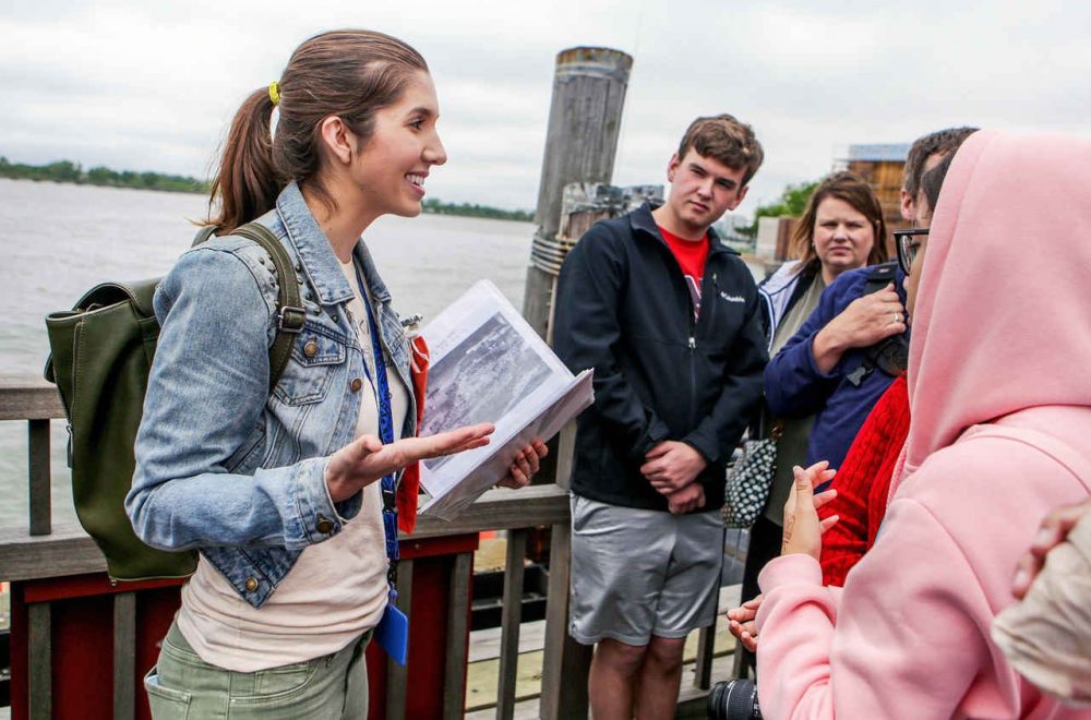local tour guide with a group of tourists on a Statue of Liberty tour
