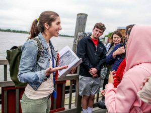 local tour guide with a group of tourists on a Statue of Liberty tour