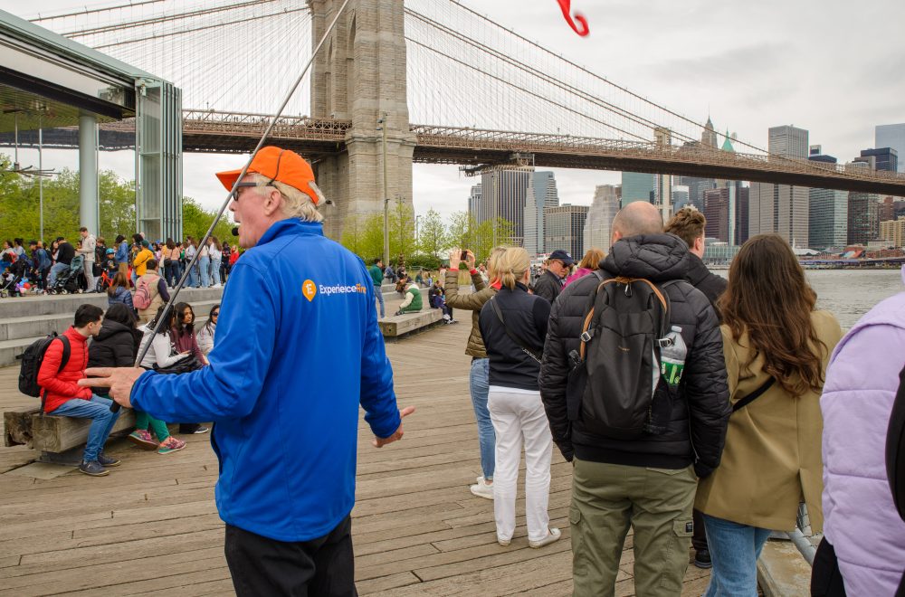 Guide leading group in Brooklyn, Bronx, Queens Bus Tour