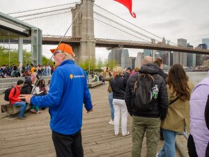 Guide leading group in Brooklyn, Bronx, Queens Bus Tour