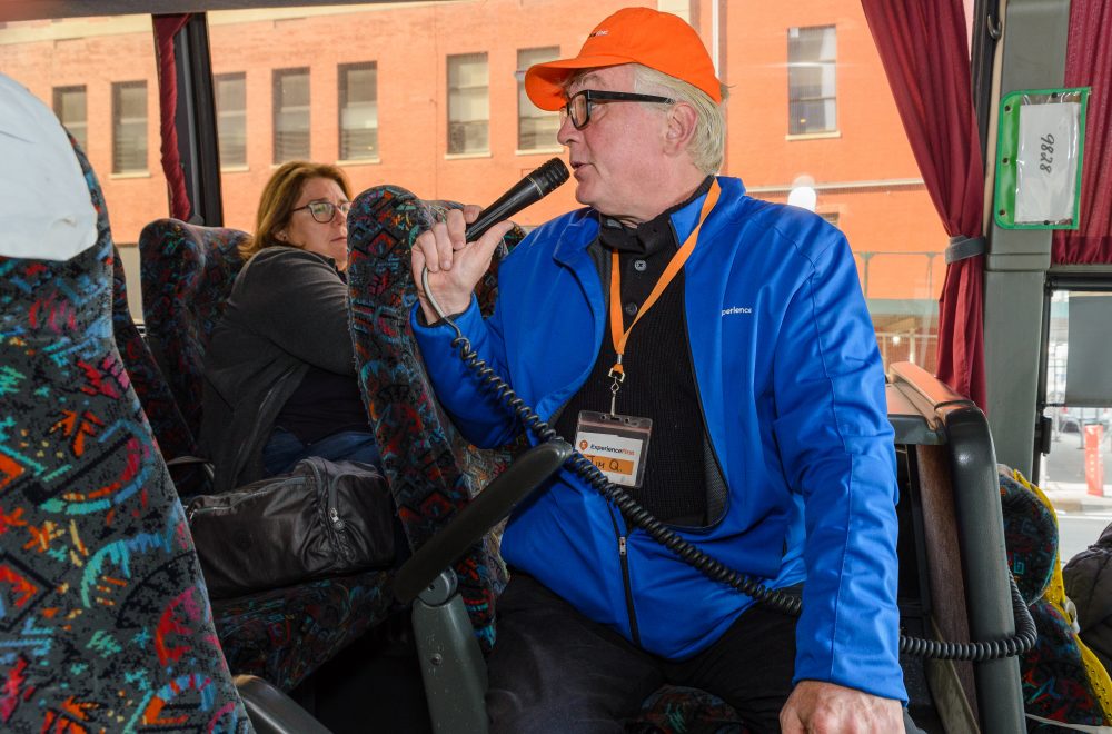 Tour Guide on Brooklyn, Bronx, Queens Bus Tour inside Bus