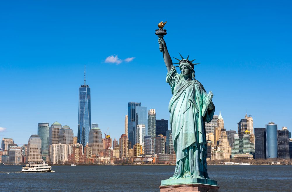 The Statue of Liberty over the Scene of New york cityscape river