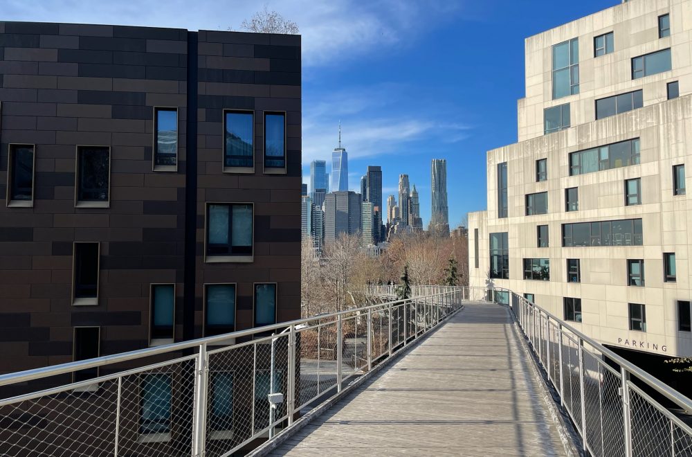 Tour stop and view of NYC through buildings during Food and Culture DUMBO Walking Tour