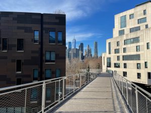 Tour stop and view of NYC through buildings during Food and Culture DUMBO Walking Tour