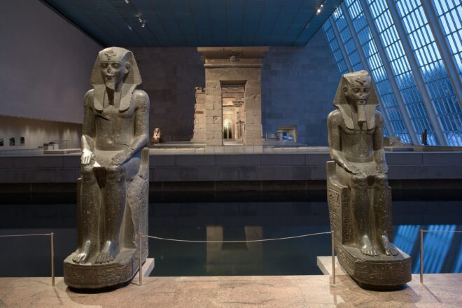 Two statues of Amenhotep III in the Temple of Dendur in the Met NYC