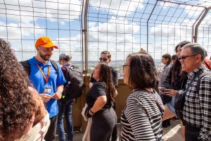 Guide interacting with travelers during Eiffel Tower Guided Climb