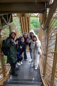 Tour guide and group posing during the Eiffel Tower Guided Climb