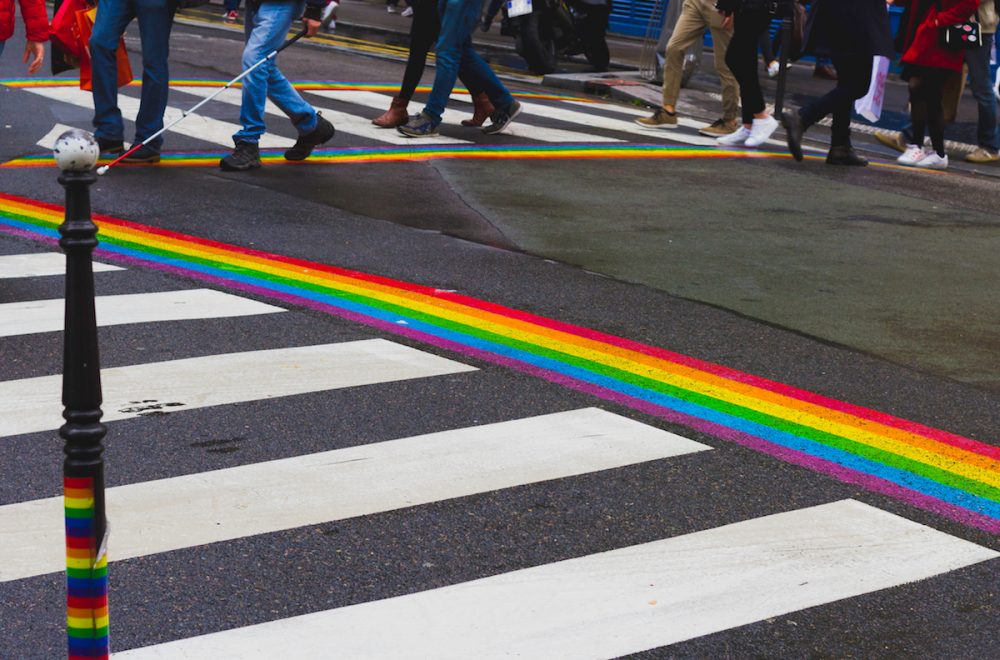 Pedestrian crosswalk with painted rainbow from both sides in Le Marais quarter in Paris