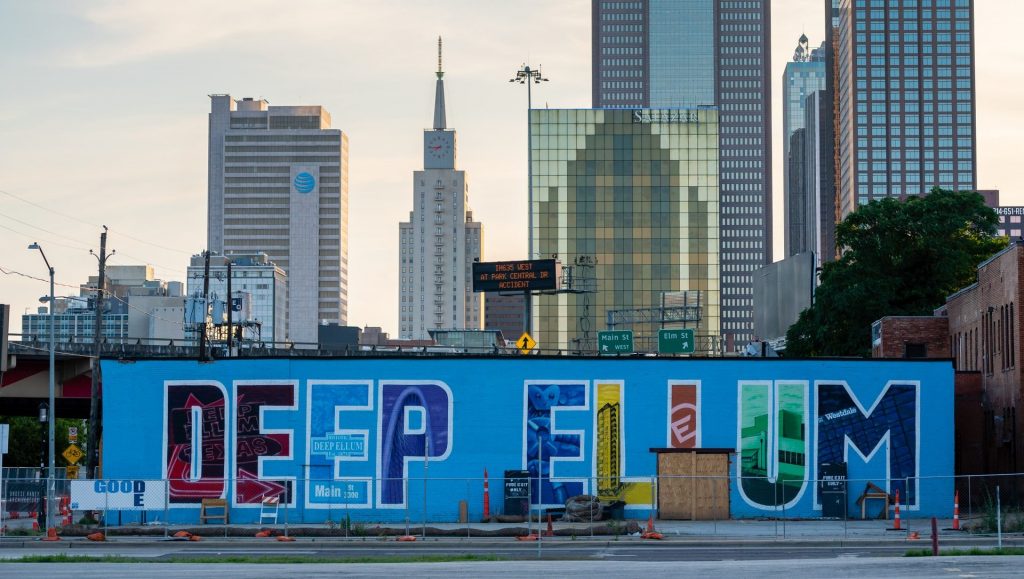 Deep Ellum mural with the name of the neighborhood