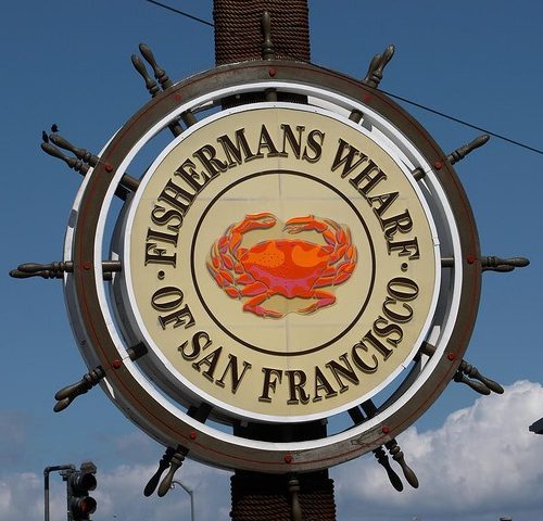 Fishermans Wharf sign with crab in the center